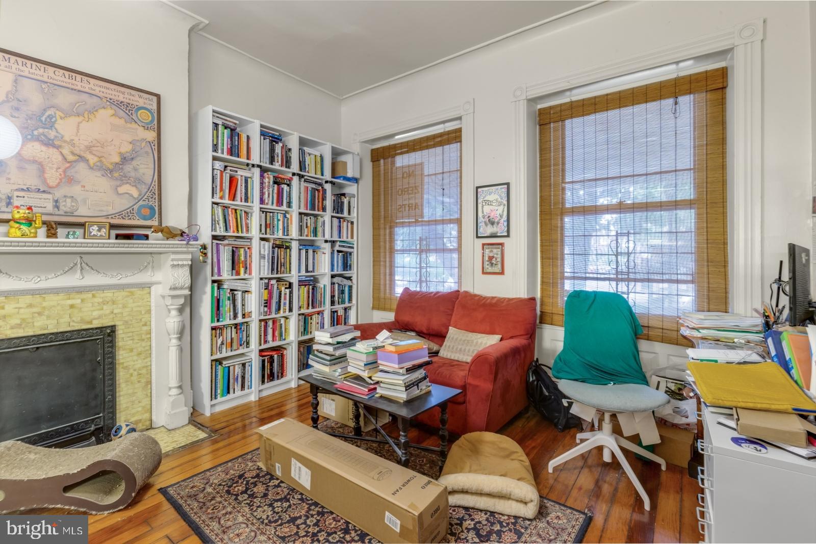 4713 Baltimore Avenue, Unit 1 Philadelphia, PA 19143 - Photo 2 of 22 a living room with furniture and a fireplace