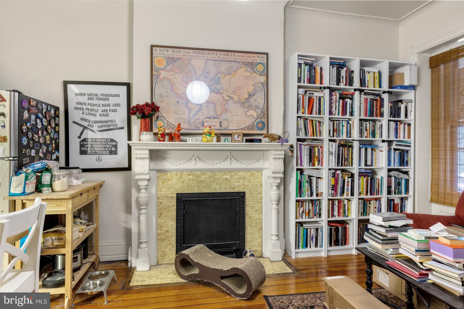 4713 Baltimore Avenue, Unit 1 Philadelphia, PA 19143 - Photo 3 of 22 a living room with furniture and a book shelf