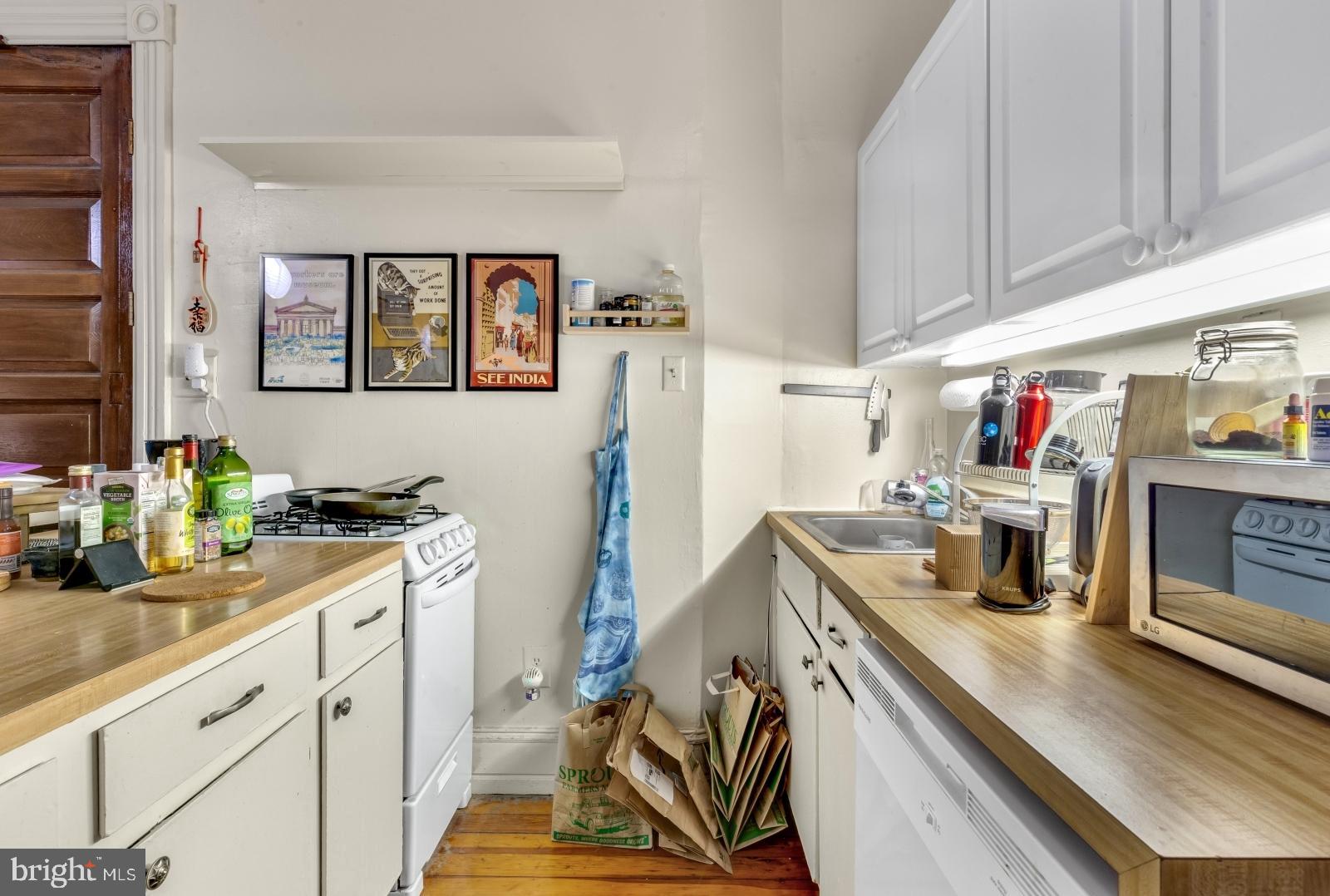 4713 Baltimore Avenue, Unit 1 Philadelphia, PA 19143 - Photo 6 of 22 a kitchen with a sink appliances and cabinets