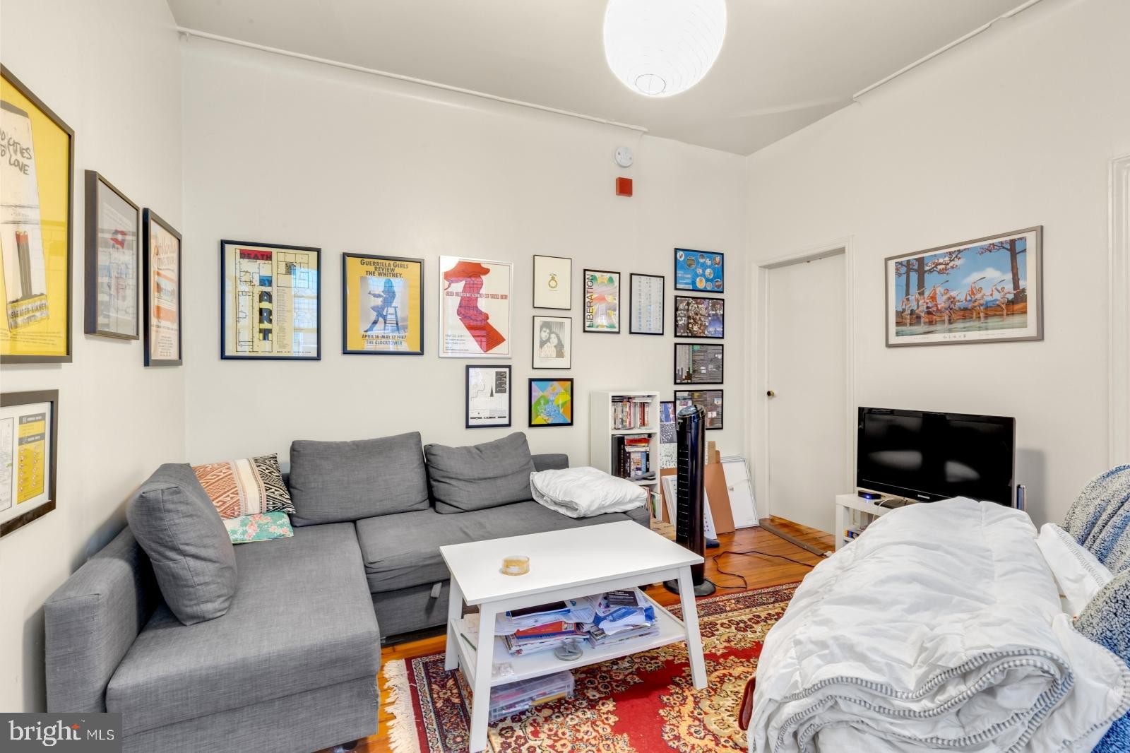 4713 Baltimore Avenue, Unit 1 Philadelphia, PA 19143 - Photo 9 of 22 a living room with furniture and a couch