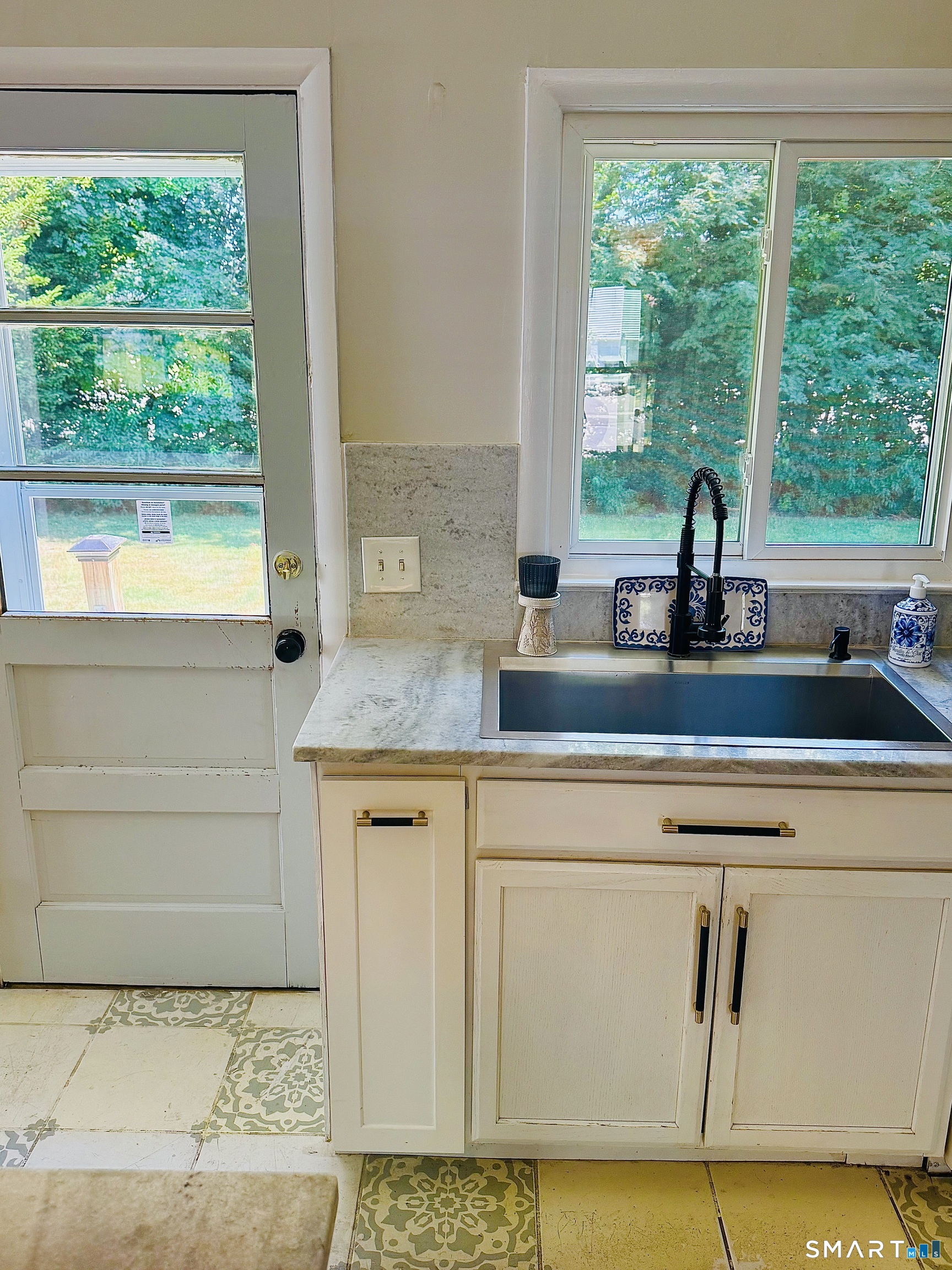 99 Lyman Road West Hartford, CT 06117 - Photo 13 of 39 Beautiful view of the patio and spacious backyard.