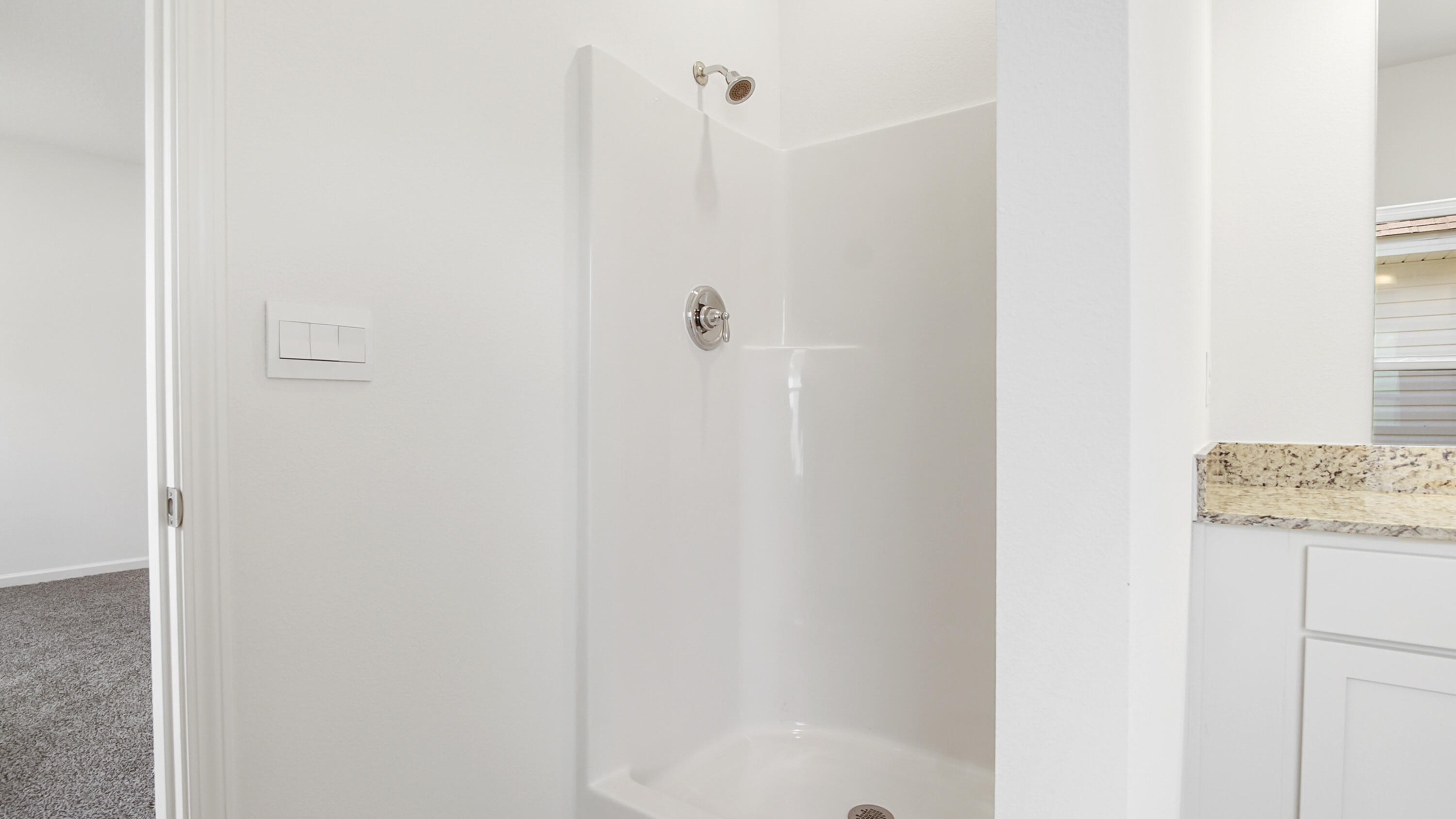 73 Longsedge Street Freeport, FL 32439 - Photo 20 of 34 a bathroom with a granite countertop shower and a sink