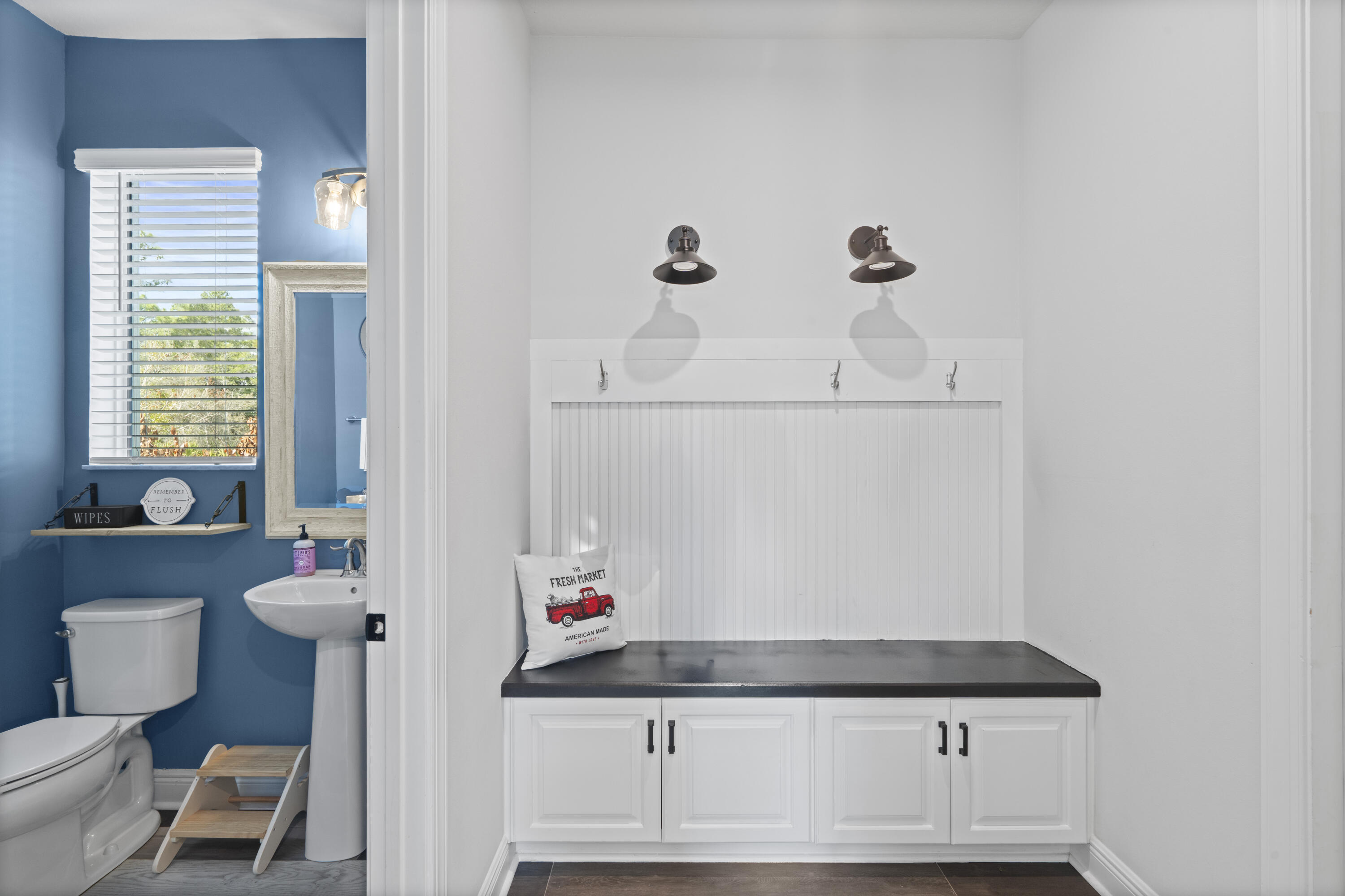 684 Southwest Pennfield Terrace Stuart, FL 34997 - Photo 15 of 61 a bathroom with a sink toilet and a mirror