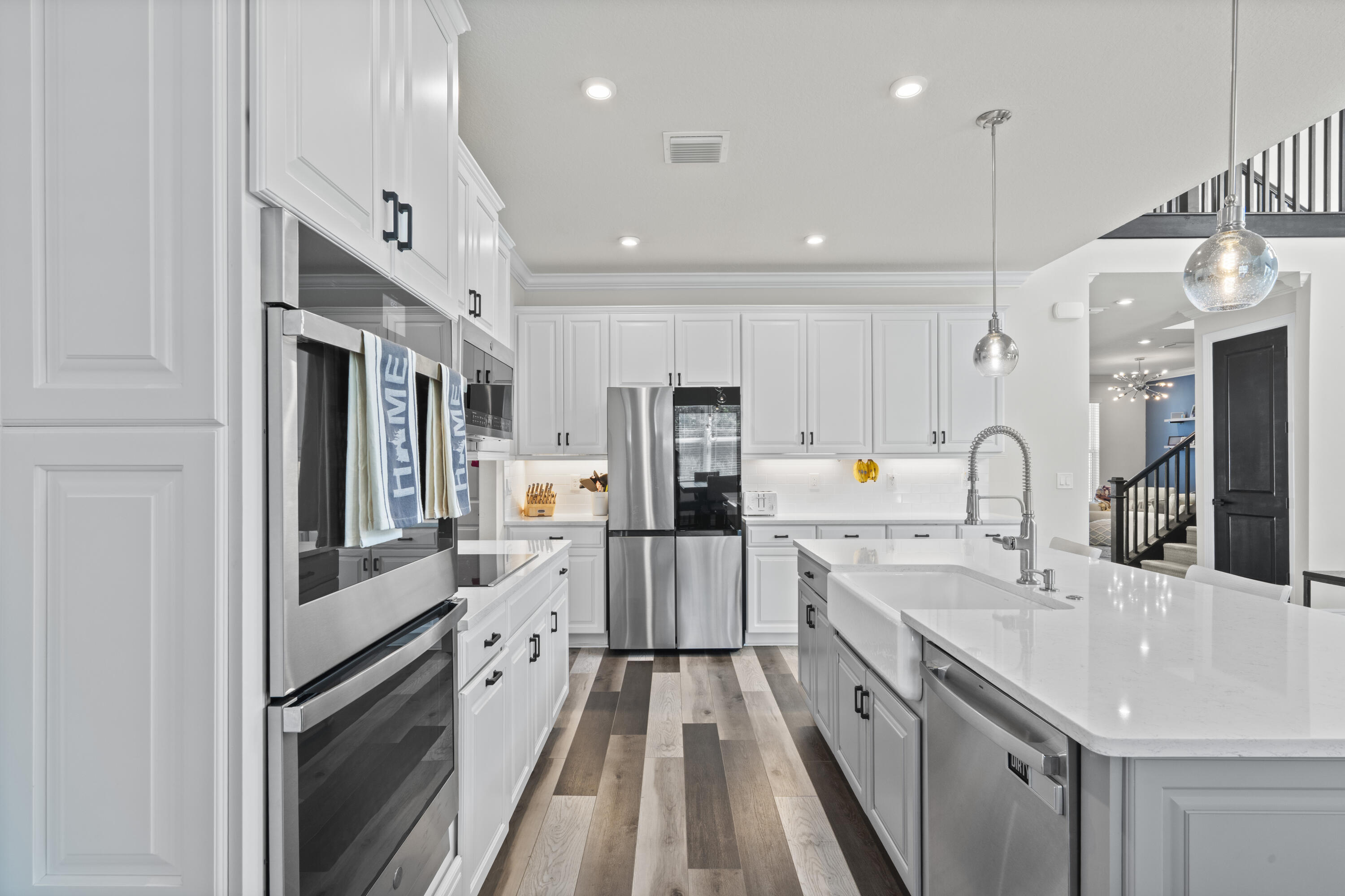 684 Southwest Pennfield Terrace Stuart, FL 34997 - Photo 17 of 61 a large kitchen with stainless steel appliances lots of counter space and a sink