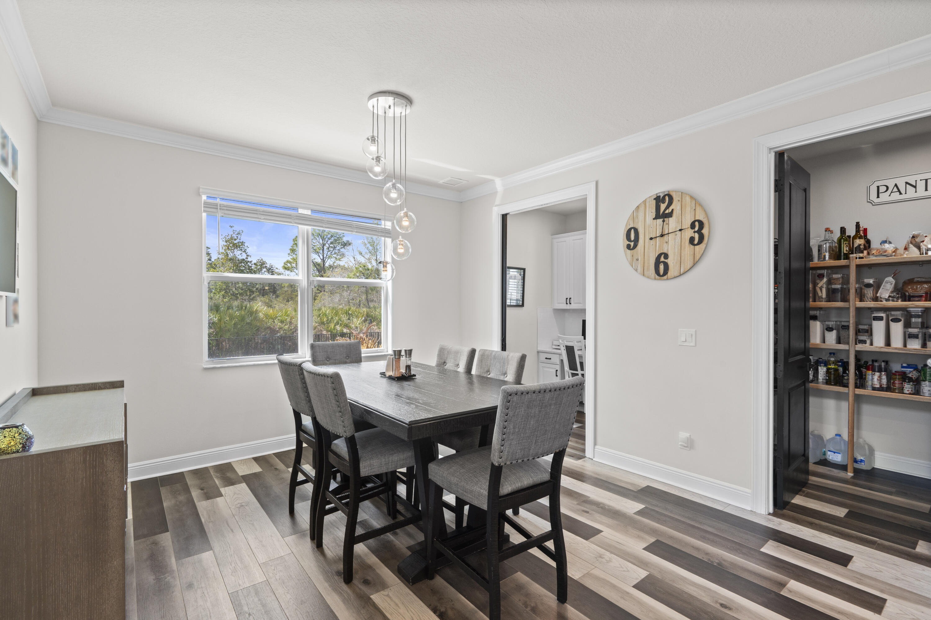 684 Southwest Pennfield Terrace Stuart, FL 34997 - Photo 18 of 61 a view of a dining room with furniture window and wooden floor