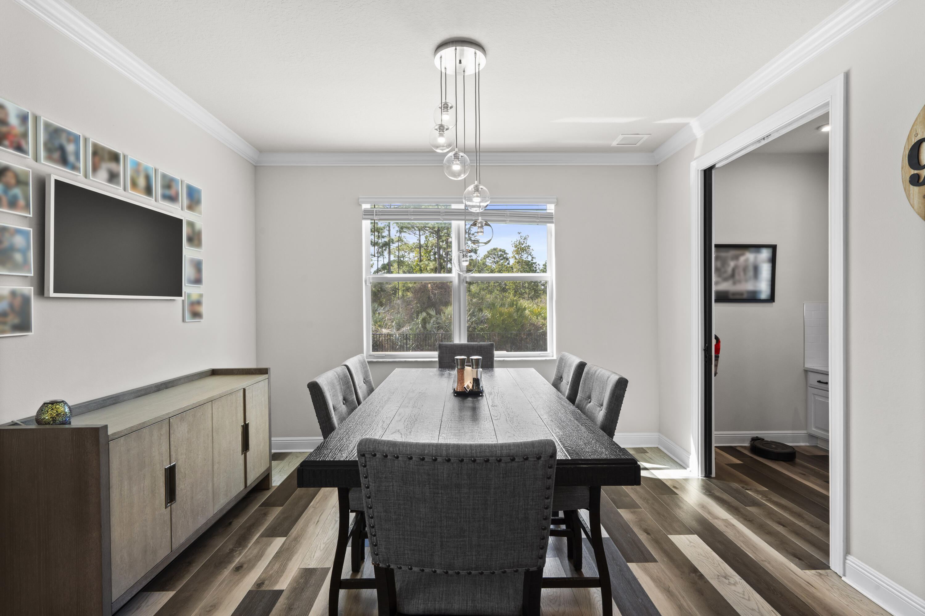 684 Southwest Pennfield Terrace Stuart, FL 34997 - Photo 19 of 61 a dining room with furniture window and wooden floor