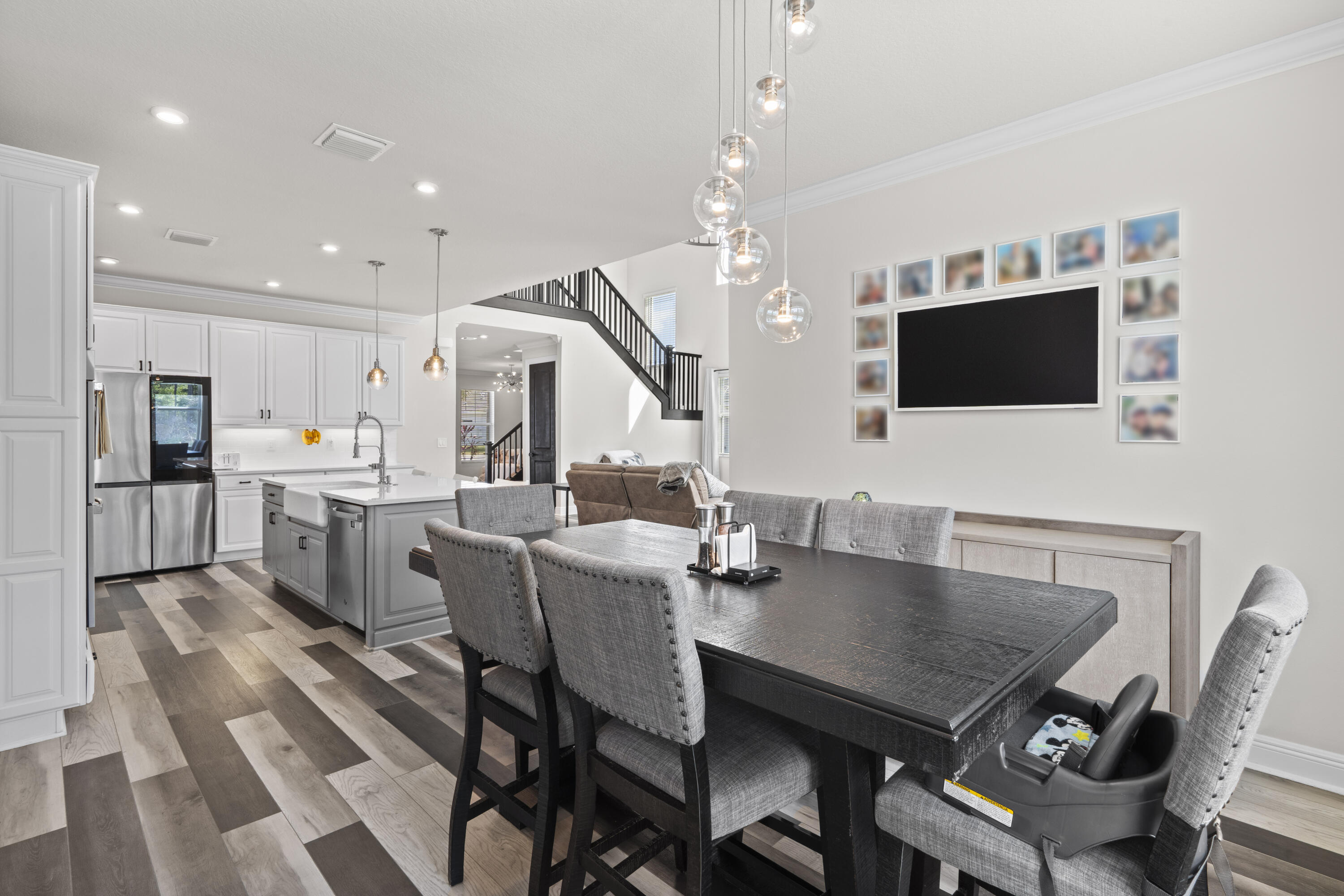 684 Southwest Pennfield Terrace Stuart, FL 34997 - Photo 20 of 61 a view of a dining room with furniture and wooden floor
