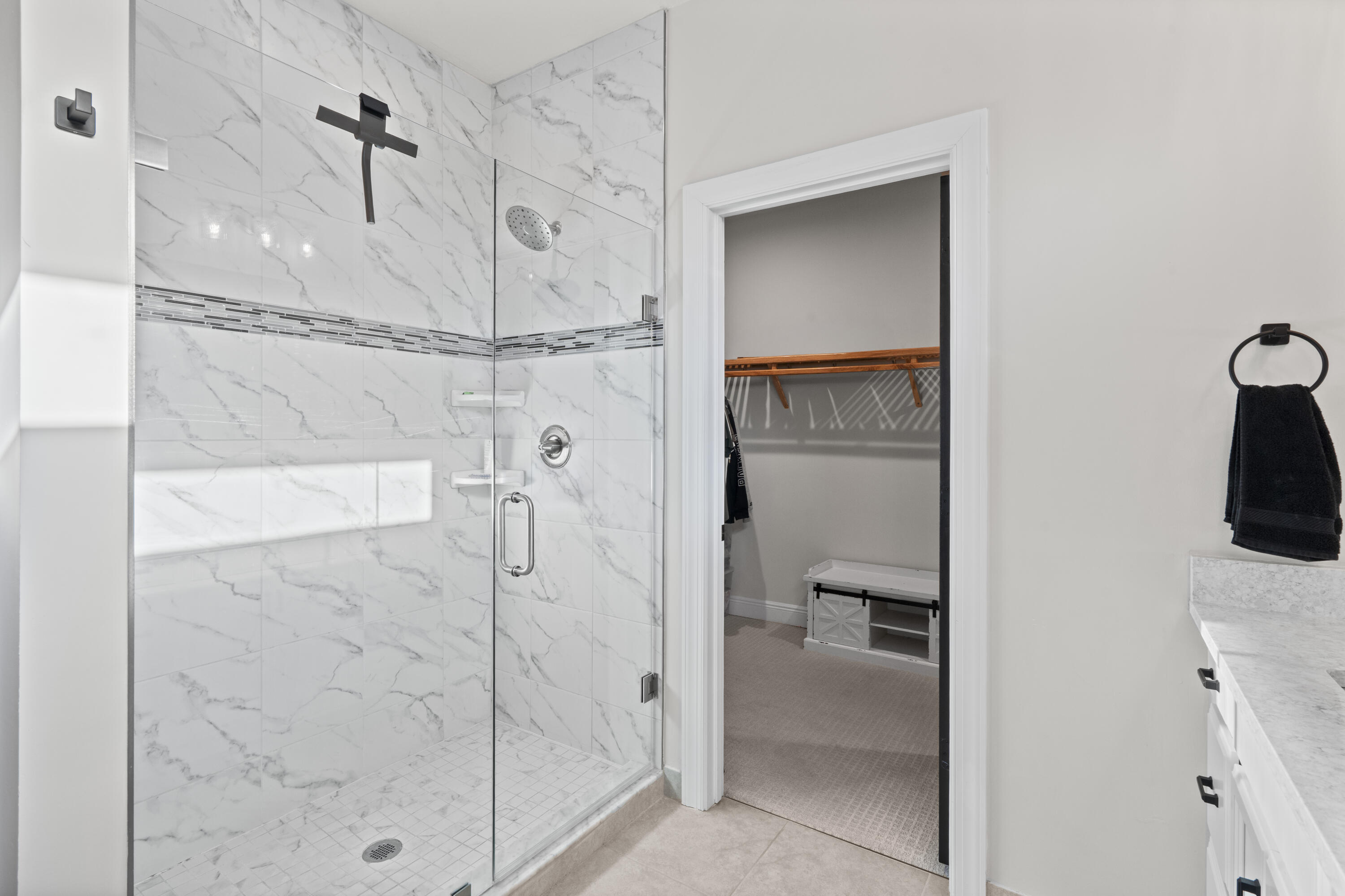 684 Southwest Pennfield Terrace Stuart, FL 34997 - Photo 28 of 61 a bathroom with a shower and a sink