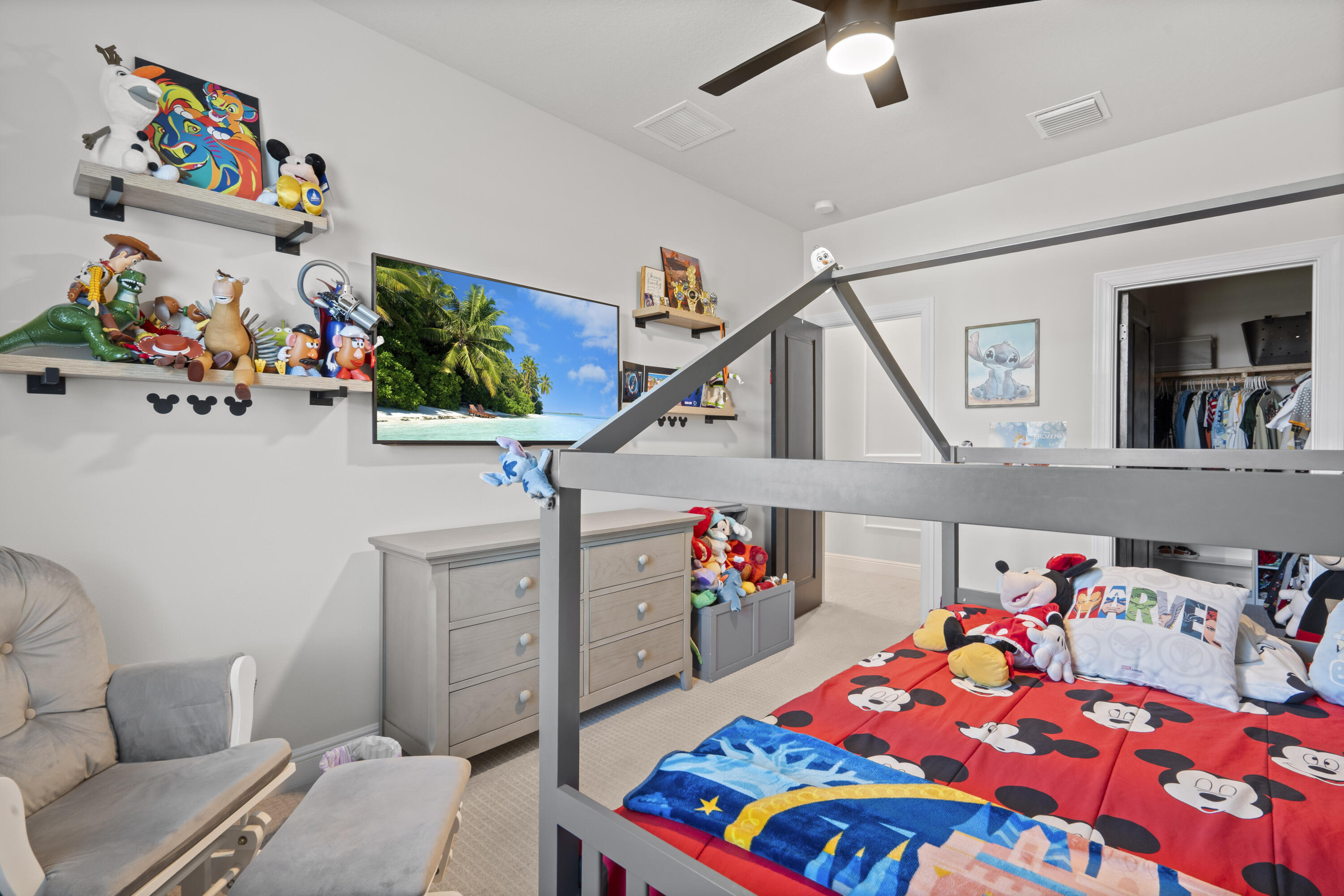 684 Southwest Pennfield Terrace Stuart, FL 34997 - Photo 30 of 61 a bedroom with furniture and a wooden floor