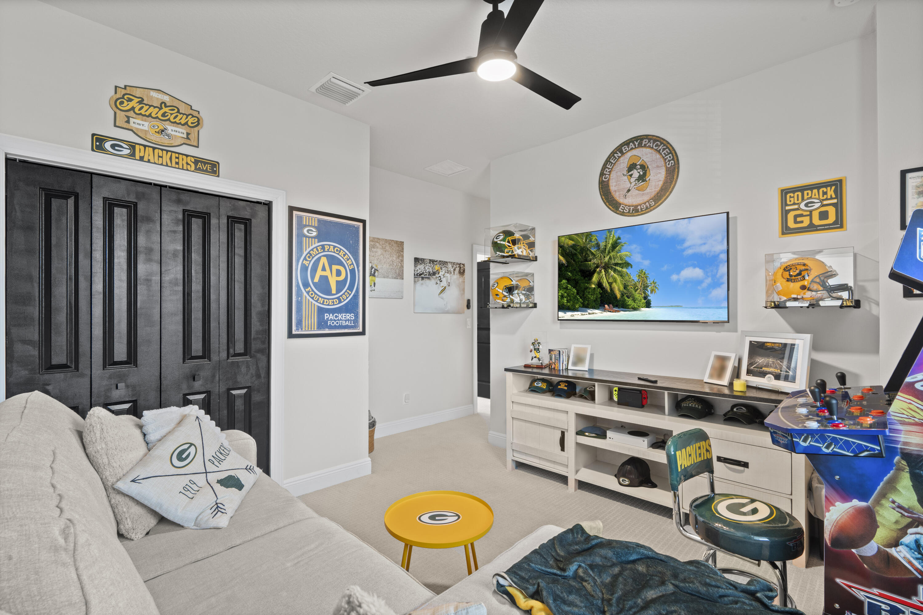 684 Southwest Pennfield Terrace Stuart, FL 34997 - Photo 36 of 61 a living room with furniture and a flat screen tv