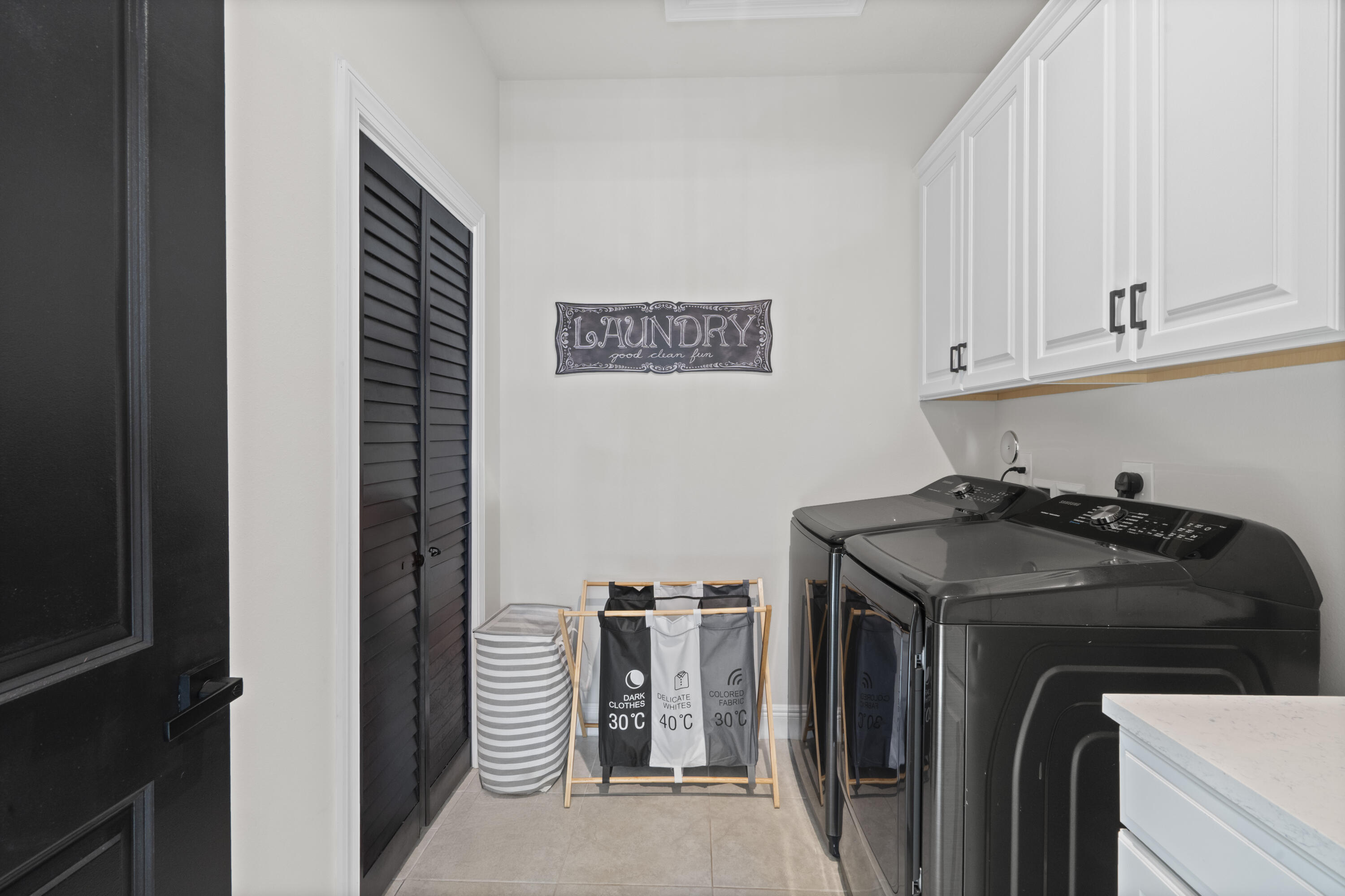 684 Southwest Pennfield Terrace Stuart, FL 34997 - Photo 37 of 61 a utility room with dryer and washer