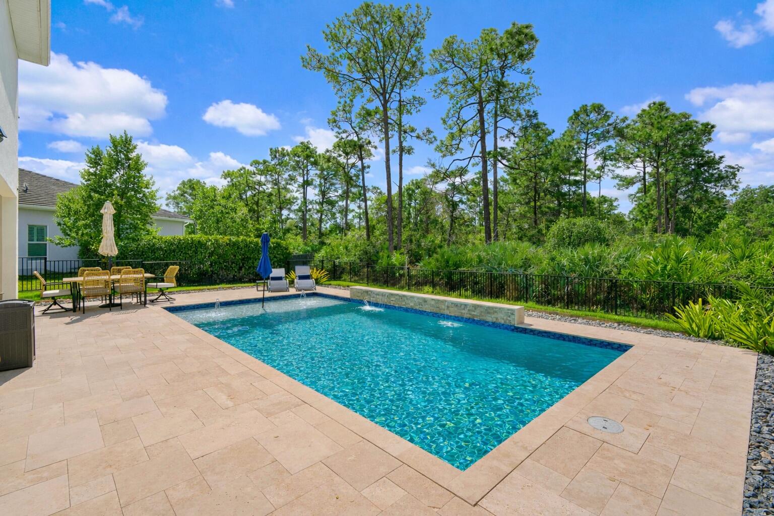 684 Southwest Pennfield Terrace Stuart, FL 34997 - Photo 41 of 61 a view of swimming pool with a lounge chair