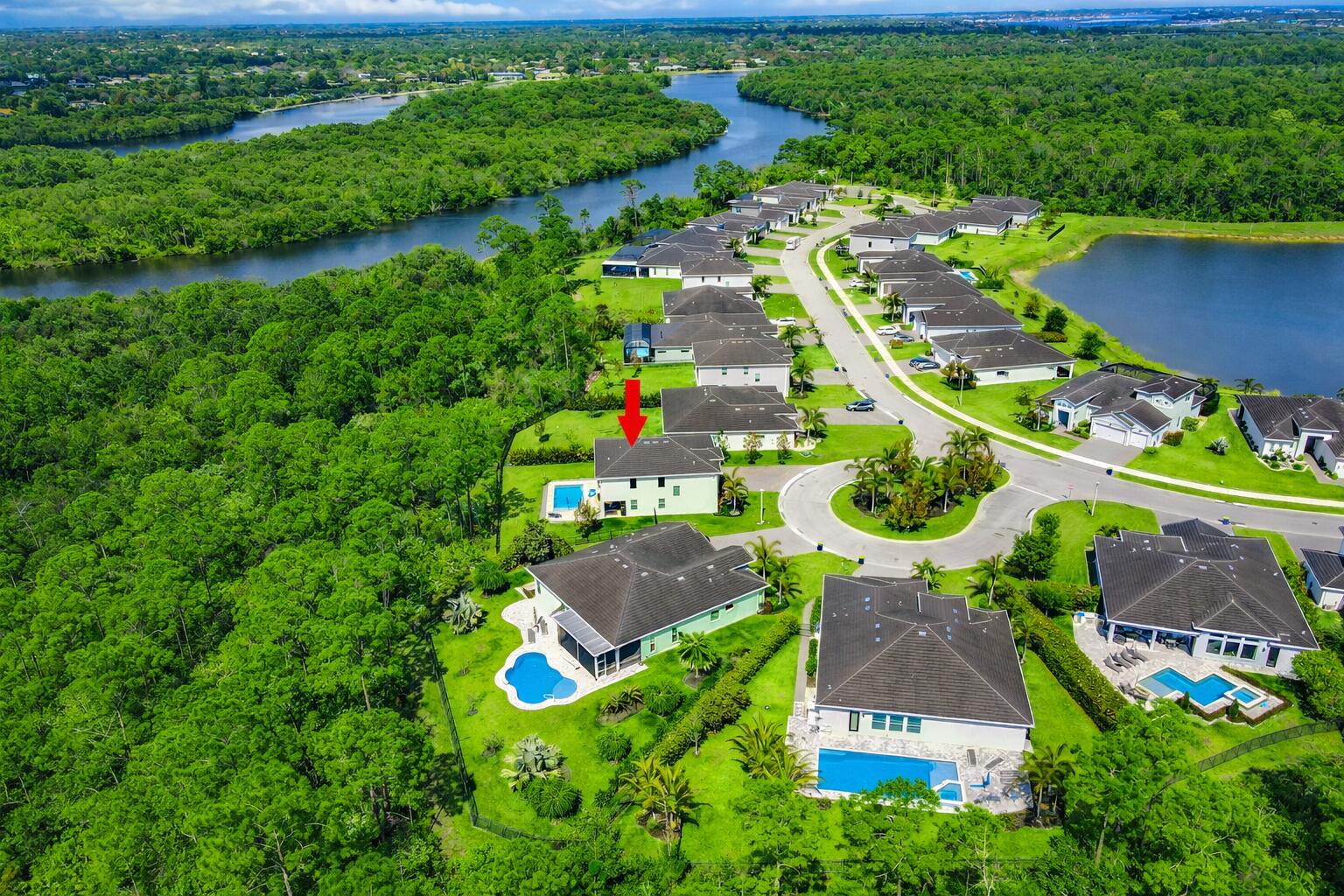 684 Southwest Pennfield Terrace Stuart, FL 34997 - Photo 44 of 61 an aerial view of residential houses with outdoor space and street view