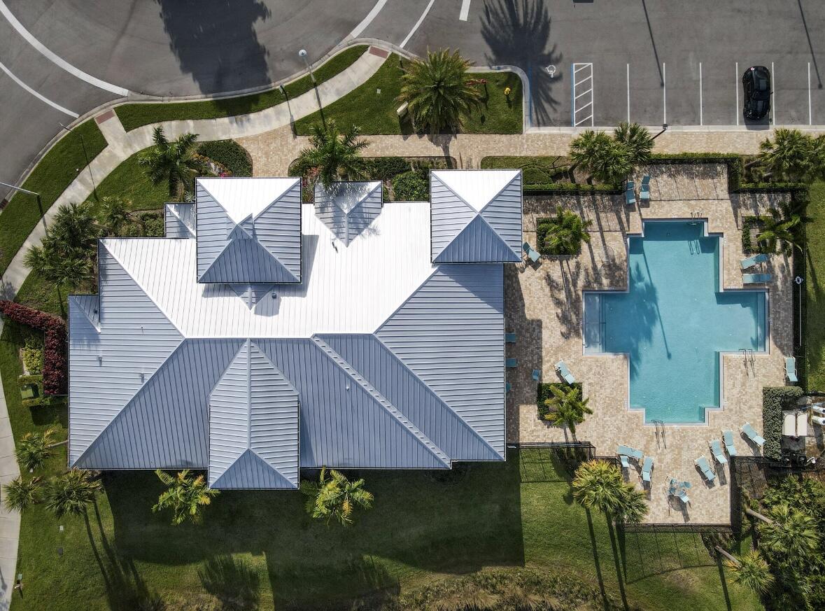 684 Southwest Pennfield Terrace Stuart, FL 34997 - Photo 47 of 61 an aerial view of a house with wooden floor and outdoor seating