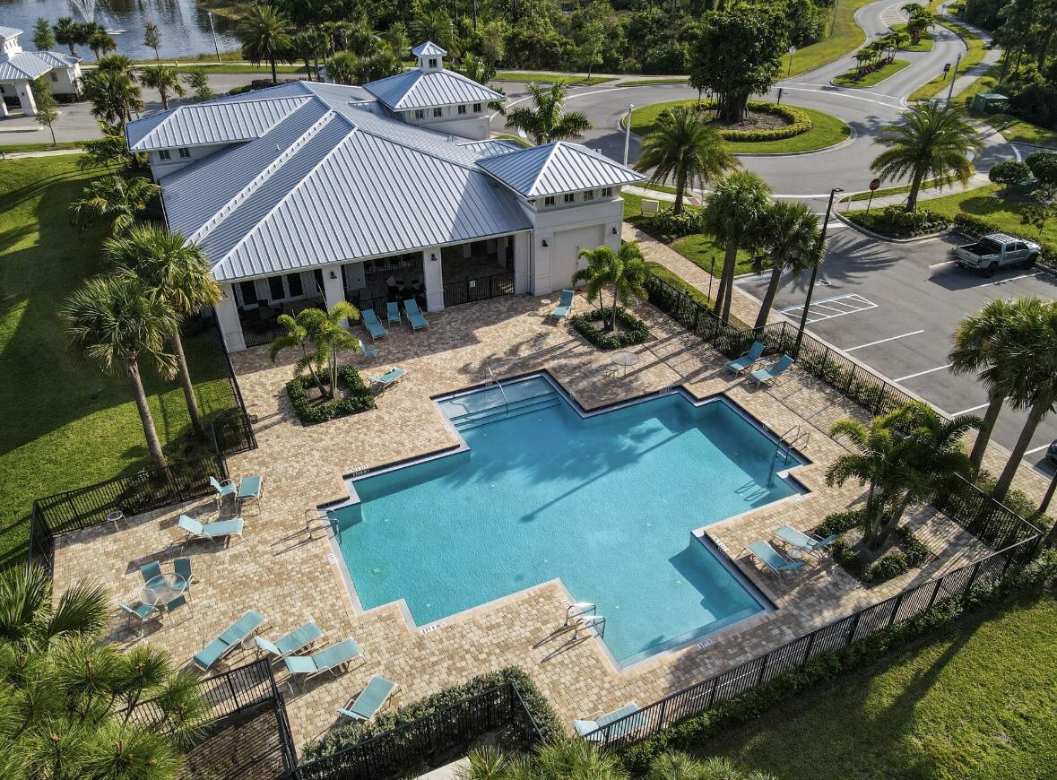 684 Southwest Pennfield Terrace Stuart, FL 34997 - Photo 48 of 61 a view of house with garden space and patio