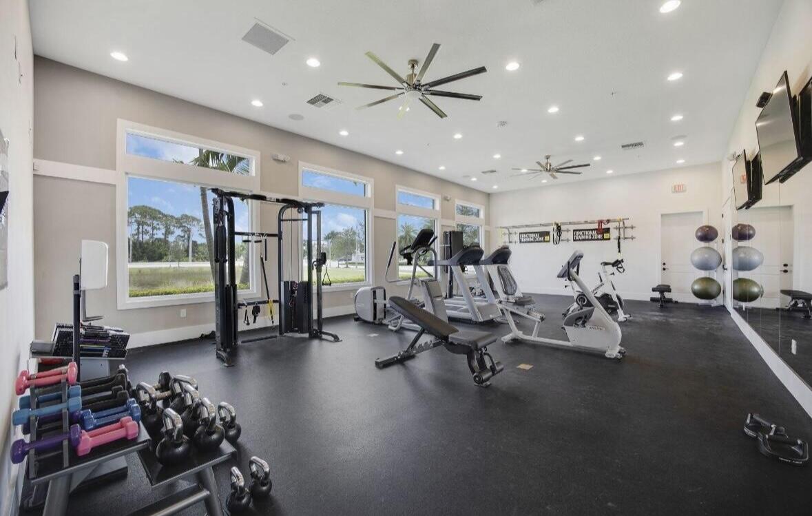 684 Southwest Pennfield Terrace Stuart, FL 34997 - Photo 57 of 61 a view of a room with gym equipment