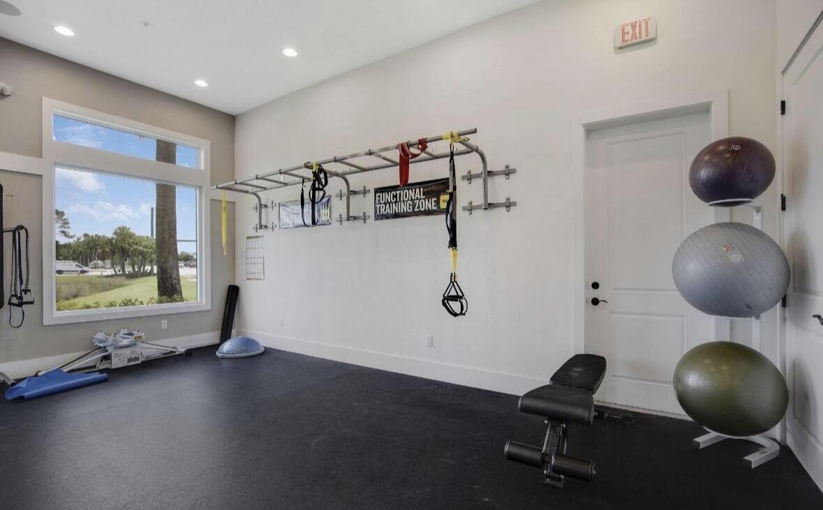 684 Southwest Pennfield Terrace Stuart, FL 34997 - Photo 58 of 61 a view of a livingroom with furniture and windows