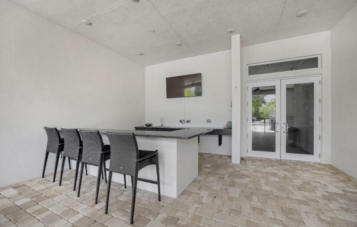 684 Southwest Pennfield Terrace Stuart, FL 34997 - Photo 61 of 61 a view of a livingroom with furniture and wooden floor