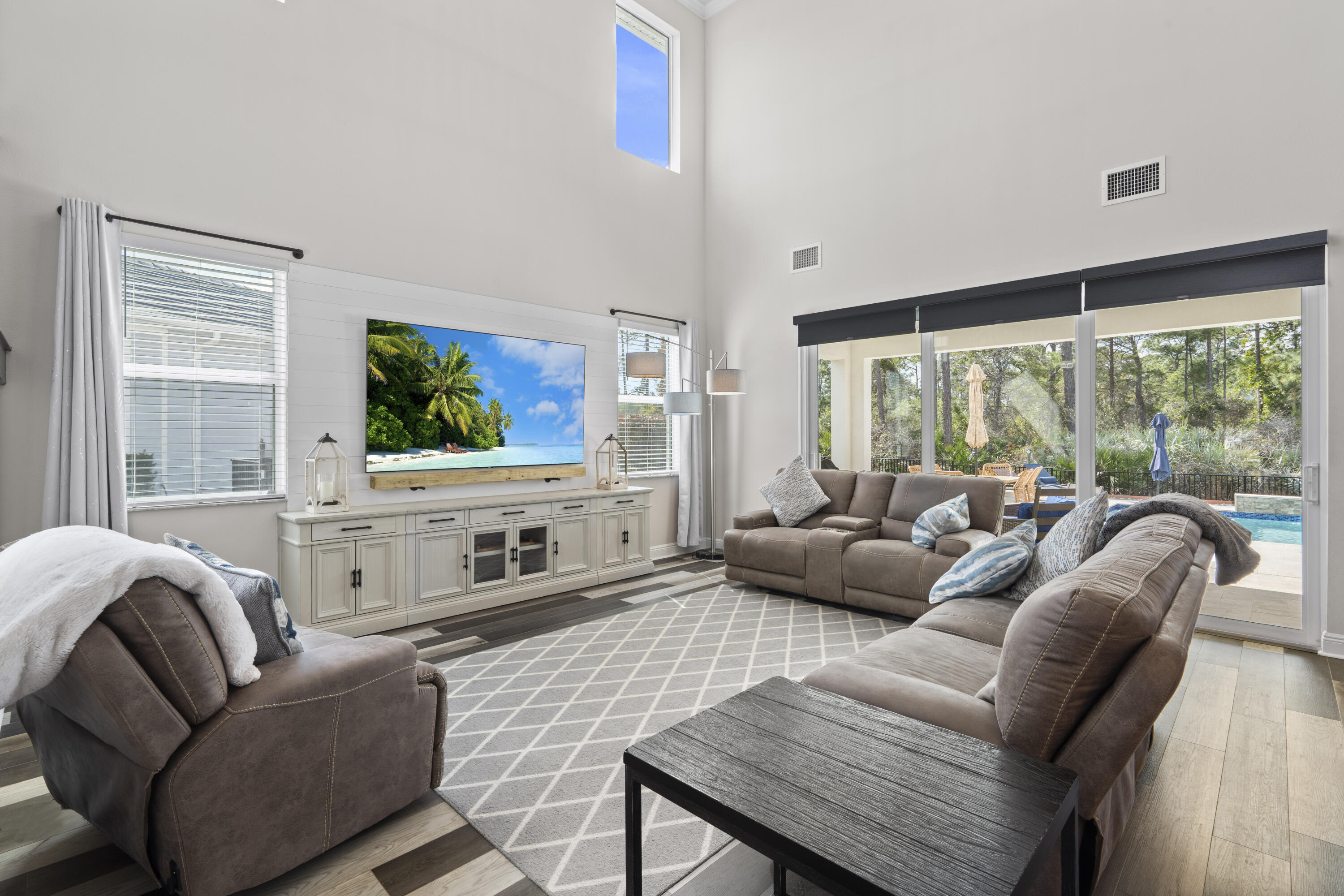 684 Southwest Pennfield Terrace Stuart, FL 34997 - Photo 9 of 61 a living room with furniture and a flat screen tv
