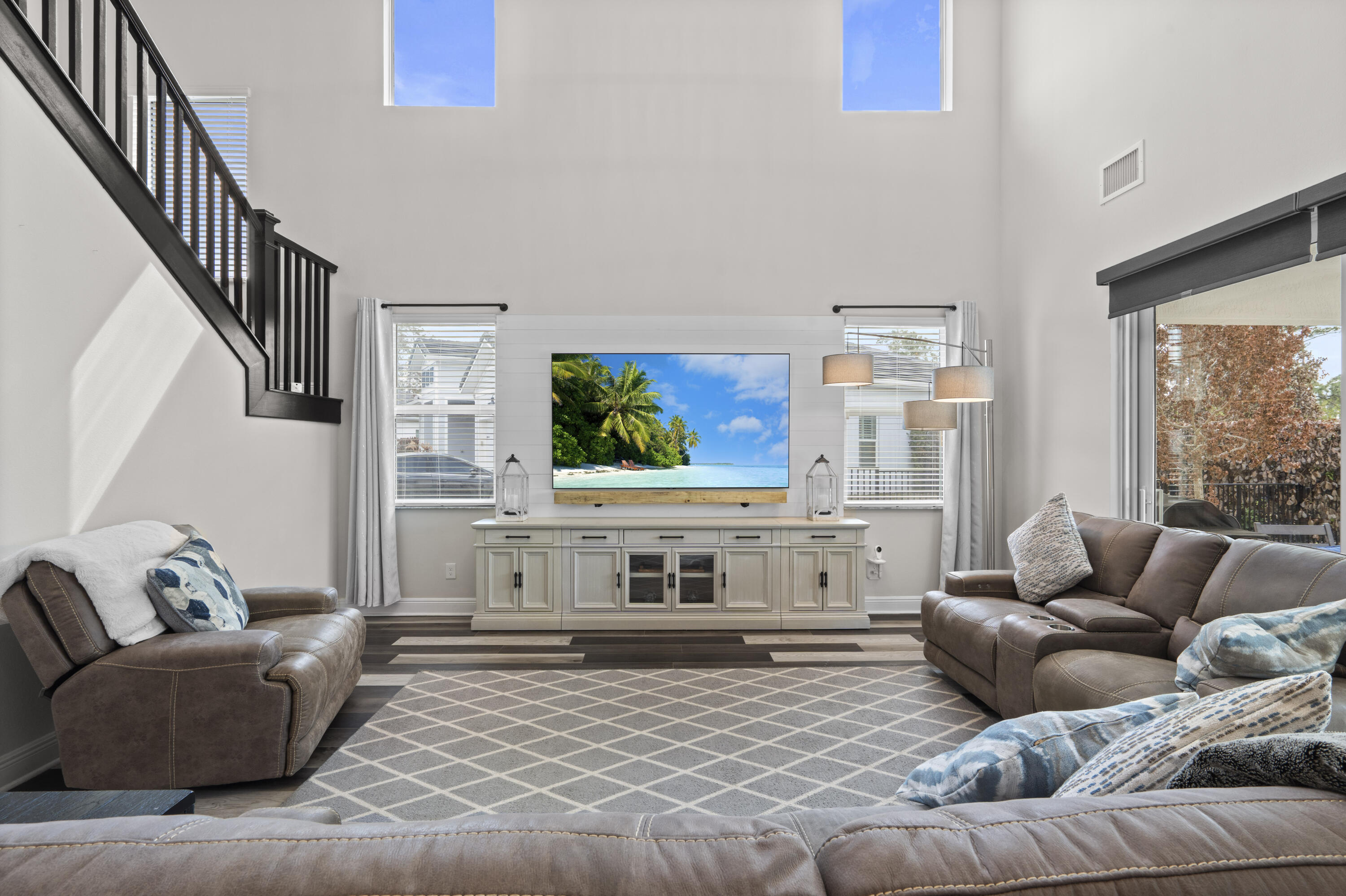 684 Southwest Pennfield Terrace Stuart, FL 34997 - Photo 10 of 61 a living room with furniture and a flat screen tv