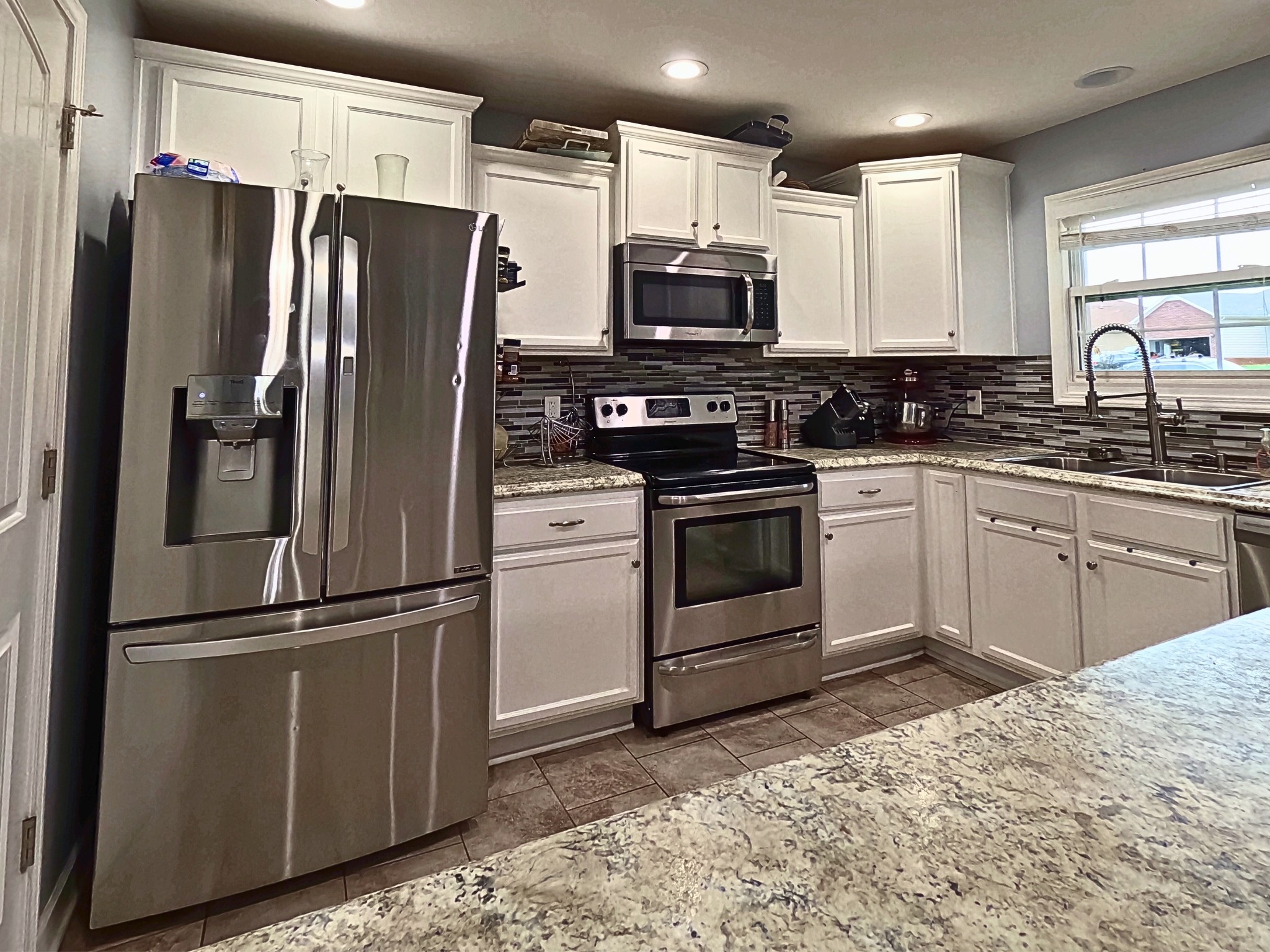 4631 Turquoise Lane Murfreesboro, TN 37129 - Photo 11 of 42 a kitchen with stainless steel appliances granite countertop a refrigerator stove and sink