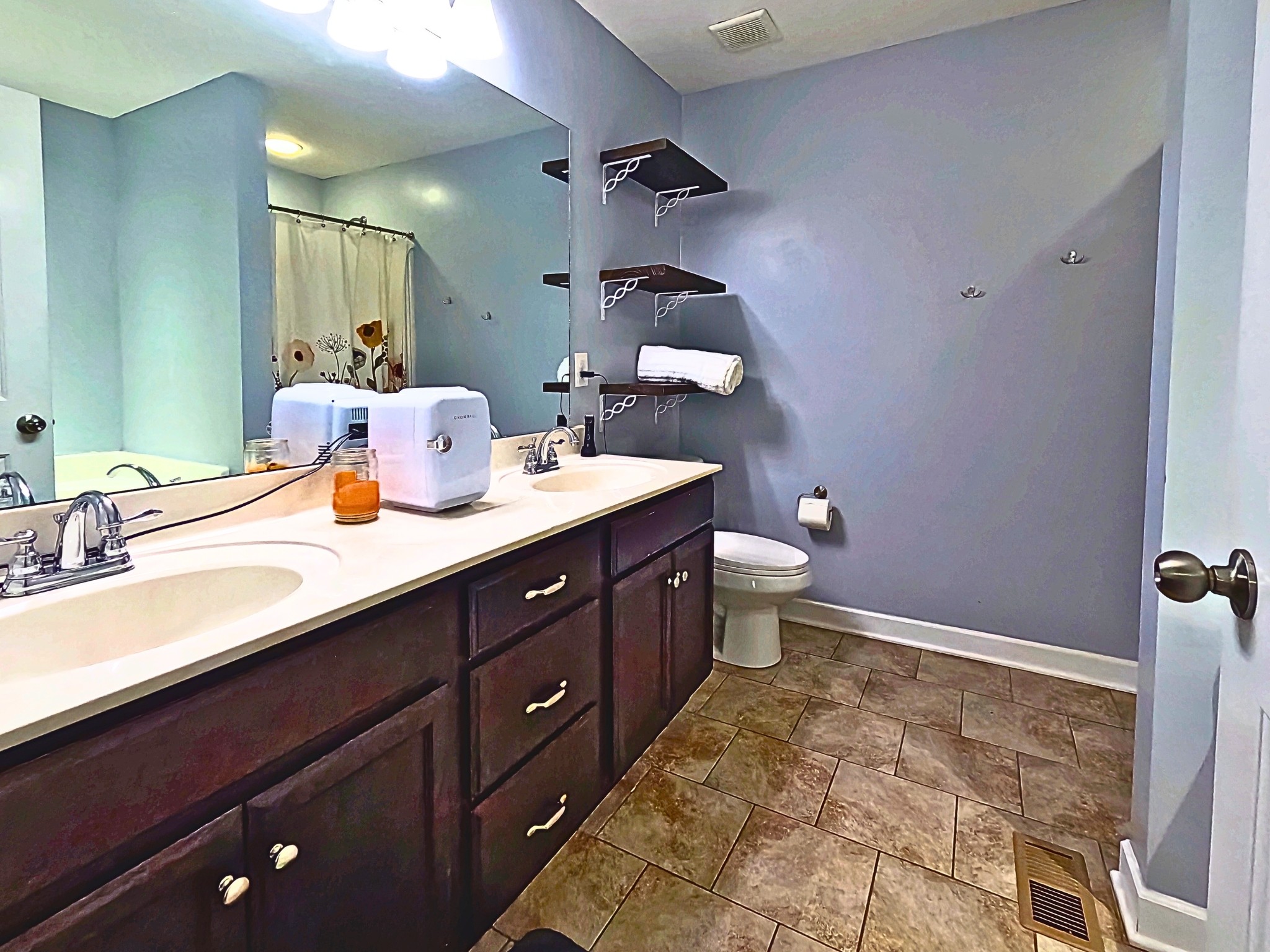 4631 Turquoise Lane Murfreesboro, TN 37129 - Photo 17 of 42 a bathroom with a double vanity sink toilet and a mirror