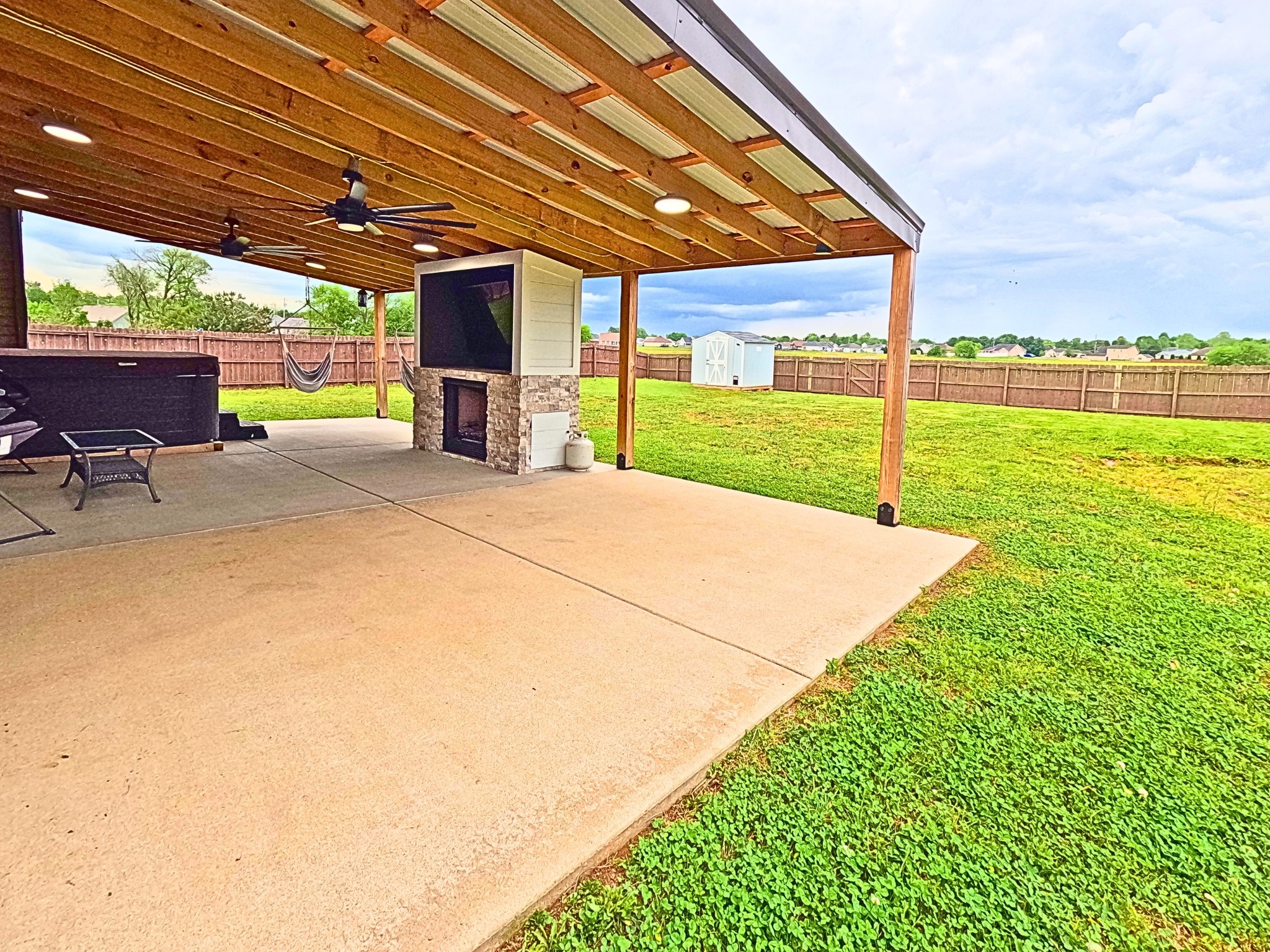 4631 Turquoise Lane Murfreesboro, TN 37129 - Photo 41 of 42 a view of a backyard with table and chairs under an umbrella