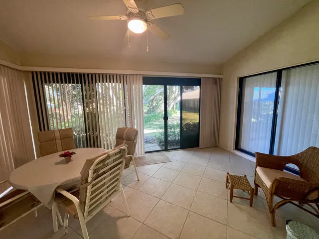 a bed room with a bed and a chair