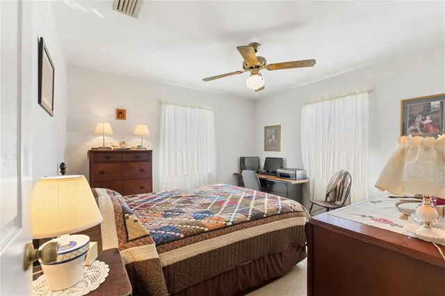 a view of a house with backyard porch and sitting area