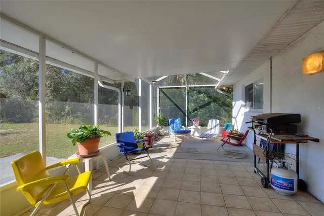 a view of yard with swimming pool and green space