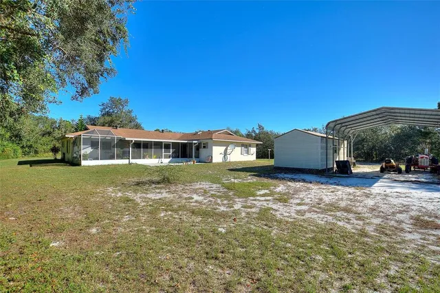 a room with lots of furniture and view of dining room