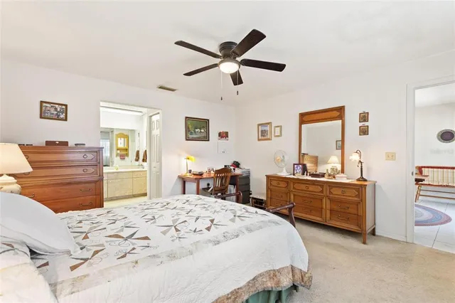 a living room with furniture fireplace and a large window