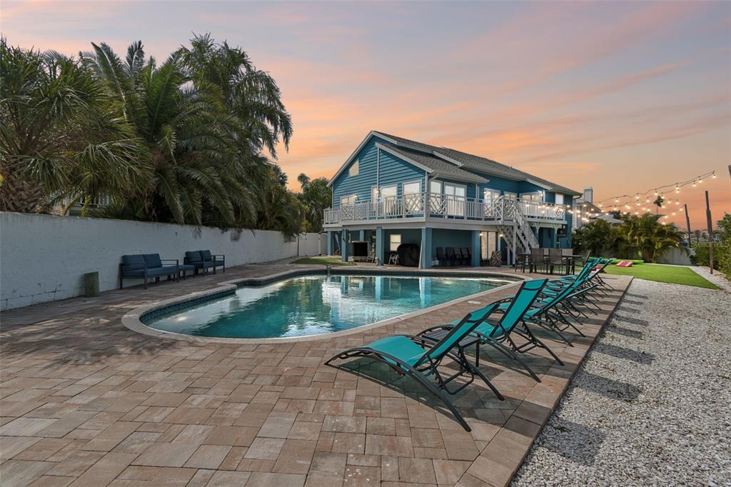 330 6th Avenue Indian Rocks Beach, FL 33785 - Photo 41 of 52 a view of a house with swimming pool and sitting area