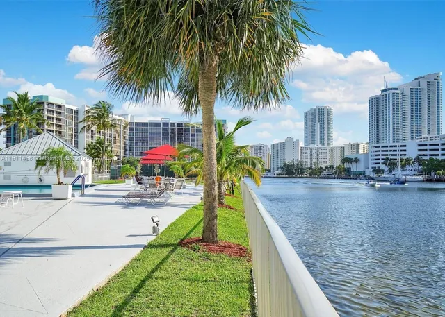 a view of a backyard and swimming pool