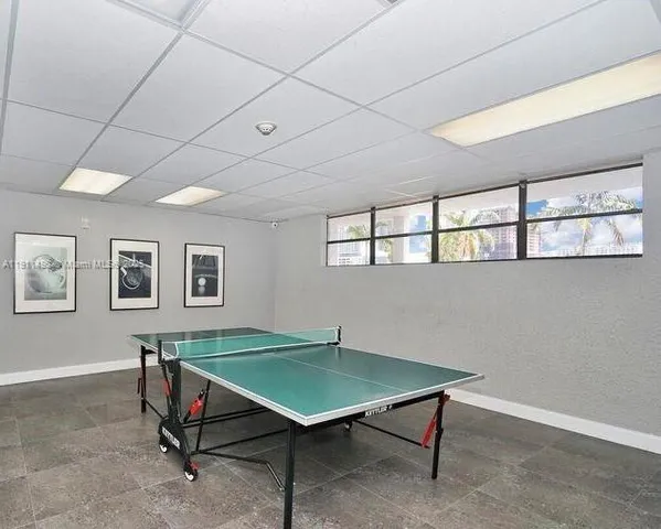 a kitchen with a sink a stove and a table