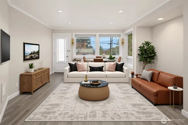 a living room with furniture a rug and a large window