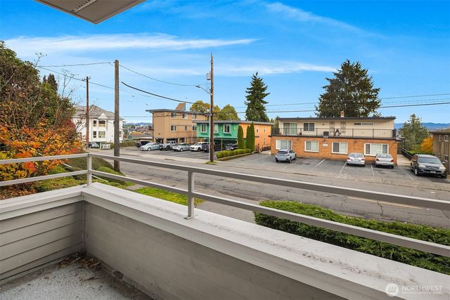 a view of a balcony with car parked