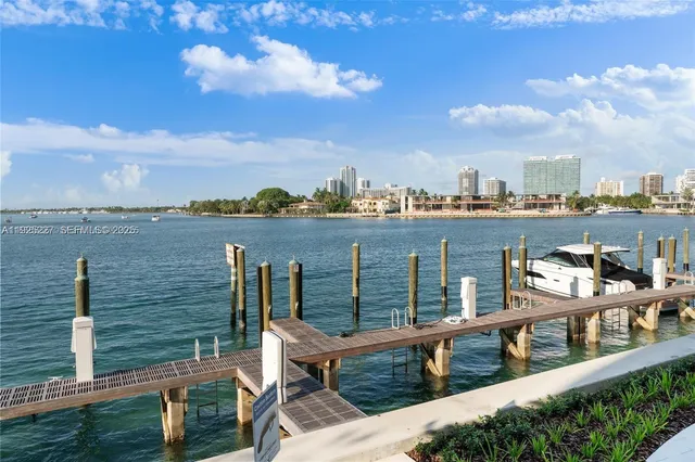 a dining room with furniture and a potted plant