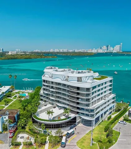 a picture of a fireplace with a table and chairs