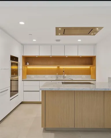 a bathroom with a tub and sink