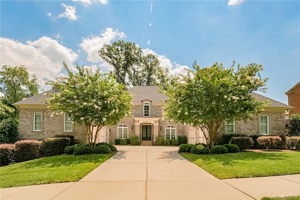 8116 Balcony Bridge Road Huntersville, NC 28078 - Photo 2 of 31 a front view of a house with a garden and trees