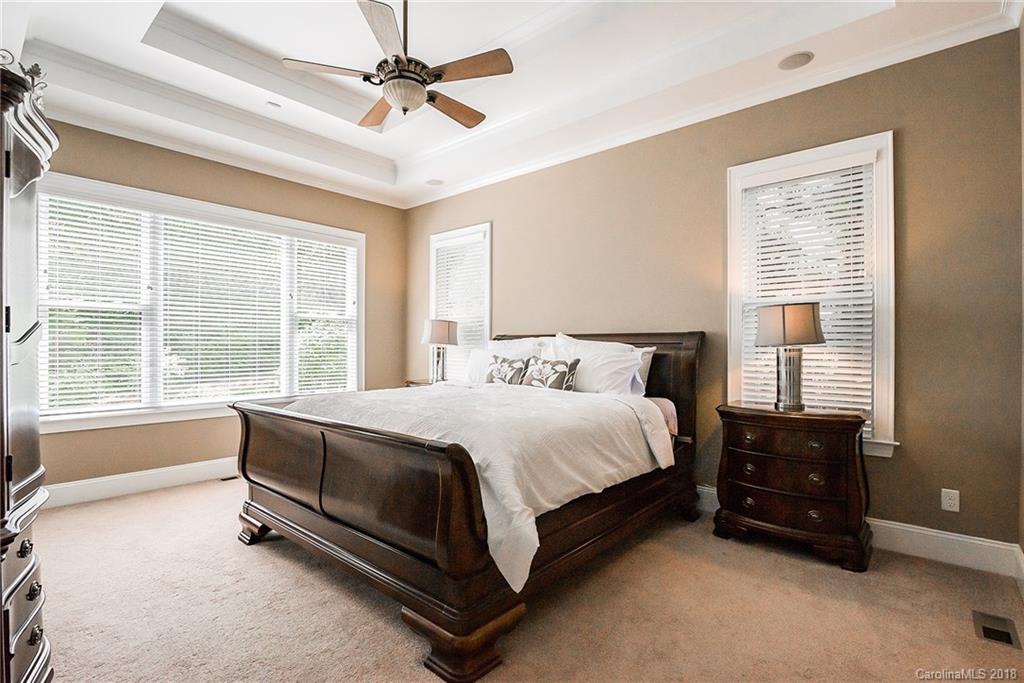 8116 Balcony Bridge Road Huntersville, NC 28078 - Photo 12 of 31 a bed sitting in a bedroom next to a window