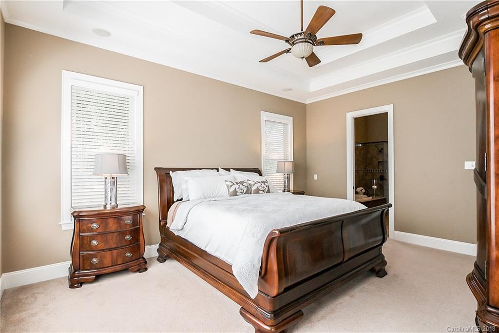 8116 Balcony Bridge Road Huntersville, NC 28078 - Photo 13 of 31 a bedroom with a bed and a ceiling fan