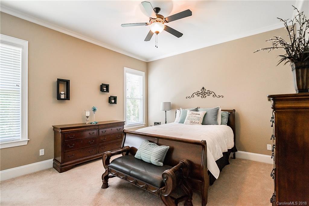 8116 Balcony Bridge Road Huntersville, NC 28078 - Photo 18 of 31 a bedroom with a bed and a chandelier
