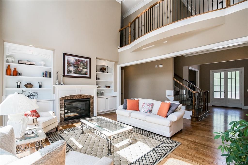 8116 Balcony Bridge Road Huntersville, NC 28078 - Photo 4 of 31 a living room with furniture and a fireplace