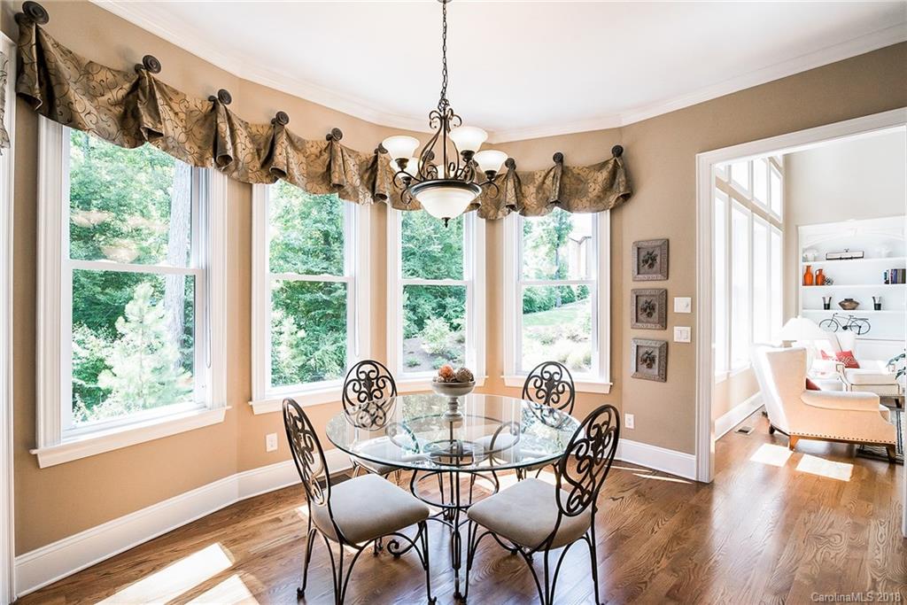 8116 Balcony Bridge Road Huntersville, NC 28078 - Photo 10 of 31 a view of a dining room with furniture window and wooden floor