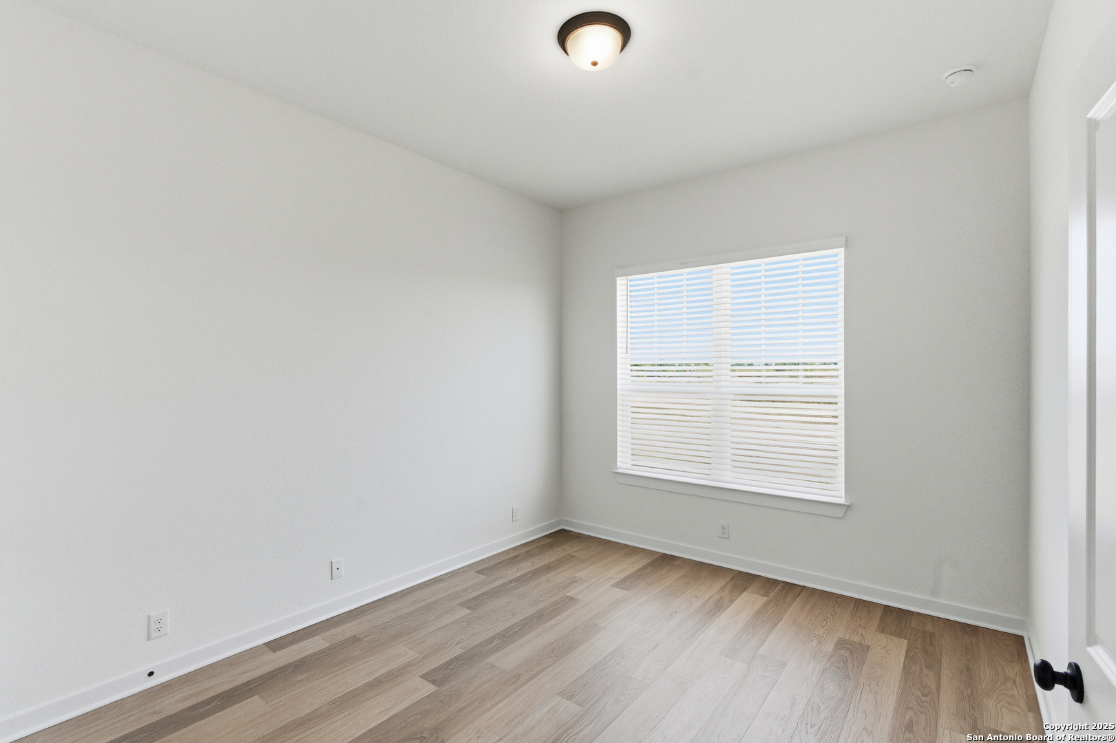 9418 Chatside Schertz, TX 78154 - Photo 8 of 50 an empty room with wooden floor and windows