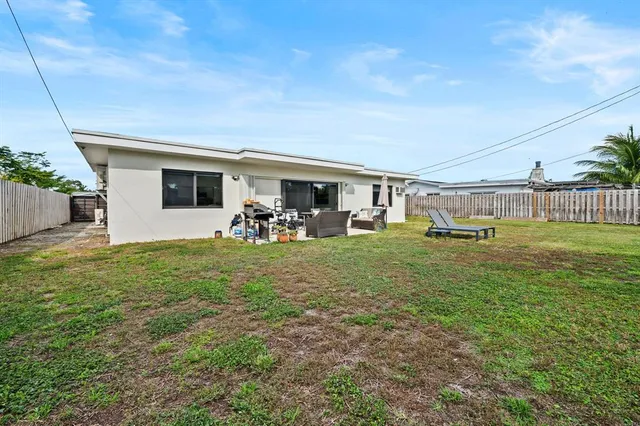 a front view of house with yard and seating area