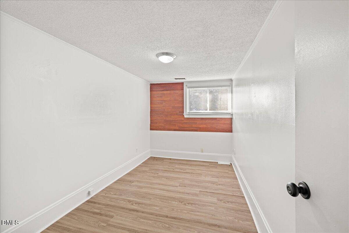 108 West Garner Road Garner, NC 27529 - Photo 15 of 53 a view of an empty room with wooden floor
