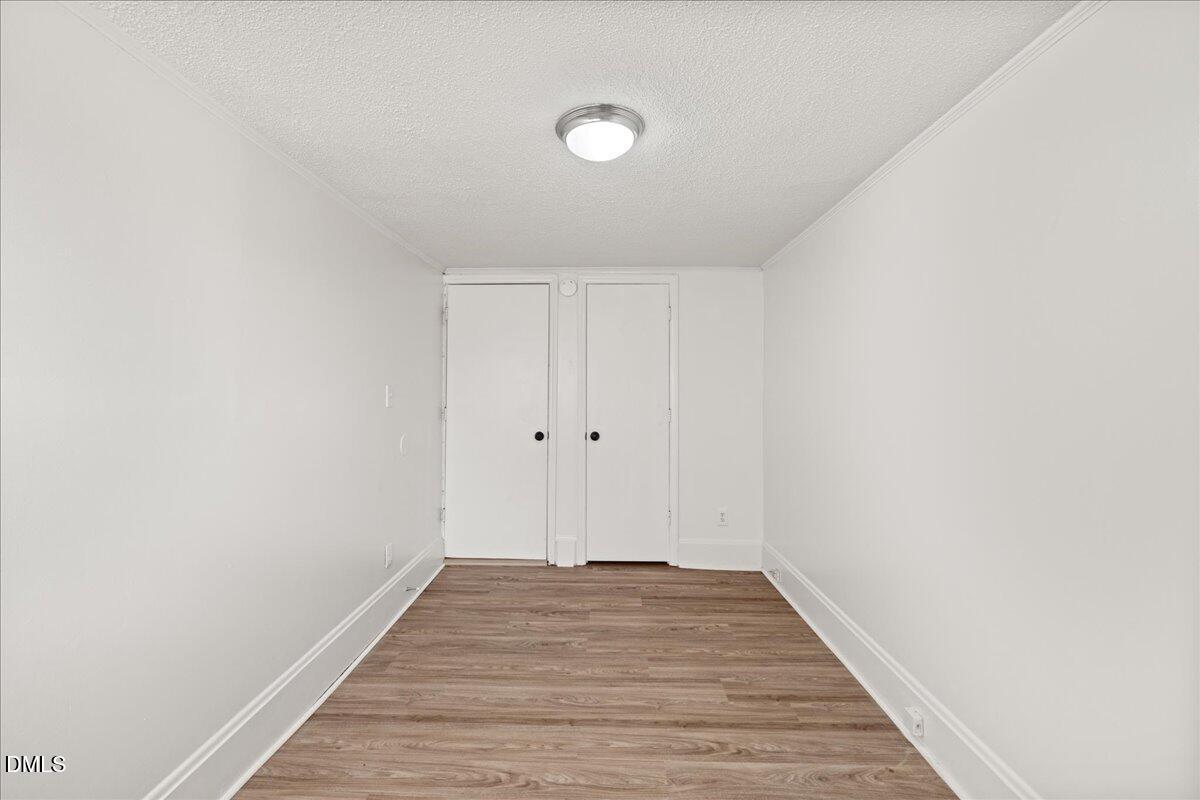 108 West Garner Road Garner, NC 27529 - Photo 16 of 53 a view of a room with wooden floor and white walls
